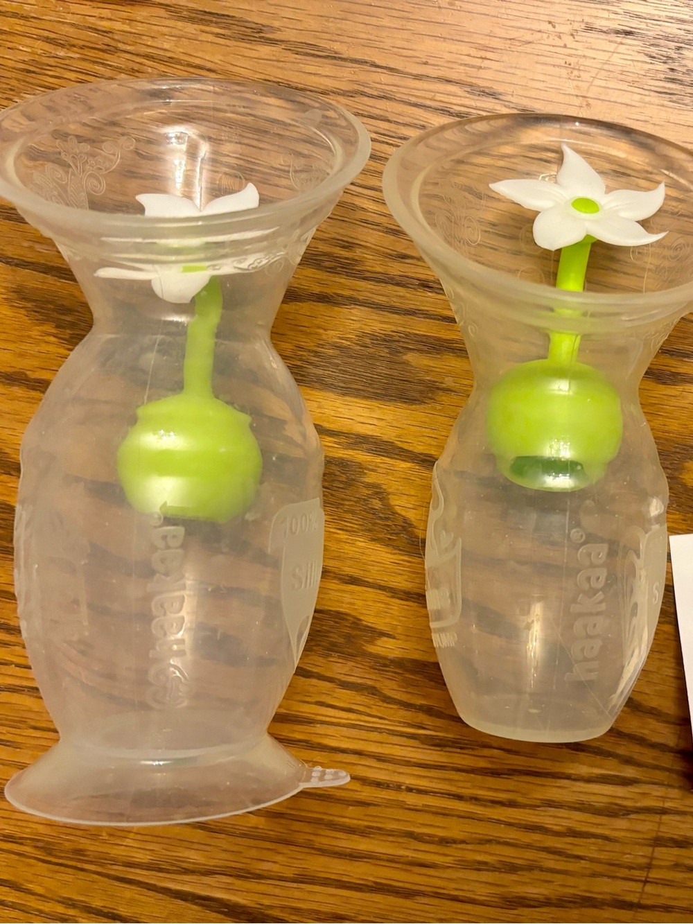 HAakaa Clear Silicone Milk Collectors with White Flower stopper